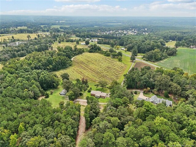 birds eye view of property featuring a rural view