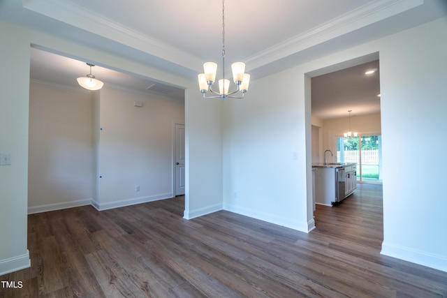 empty room with crown molding, baseboards, dark wood finished floors, visible vents, and a notable chandelier
