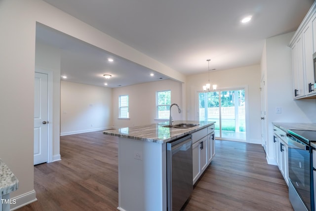 kitchen with a notable chandelier, a sink, white cabinetry, dark wood-style floors, and stainless steel appliances