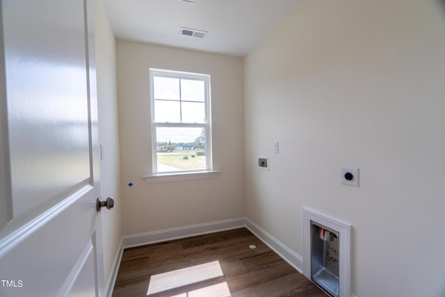 laundry area with wood finished floors, electric dryer hookup, laundry area, visible vents, and hookup for a washing machine