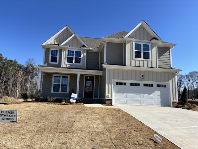 craftsman inspired home with driveway, covered porch, board and batten siding, and an attached garage