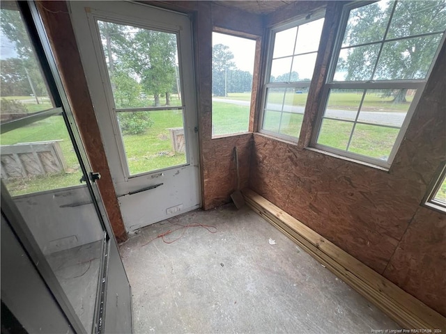 unfurnished sunroom featuring plenty of natural light