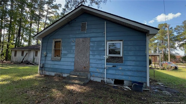 view of home's exterior with a yard