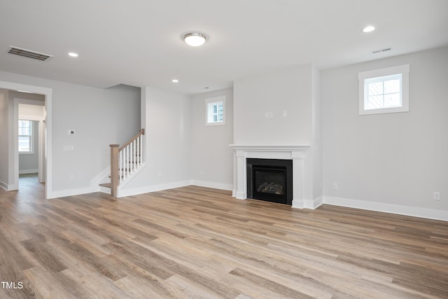 unfurnished living room with light wood-type flooring