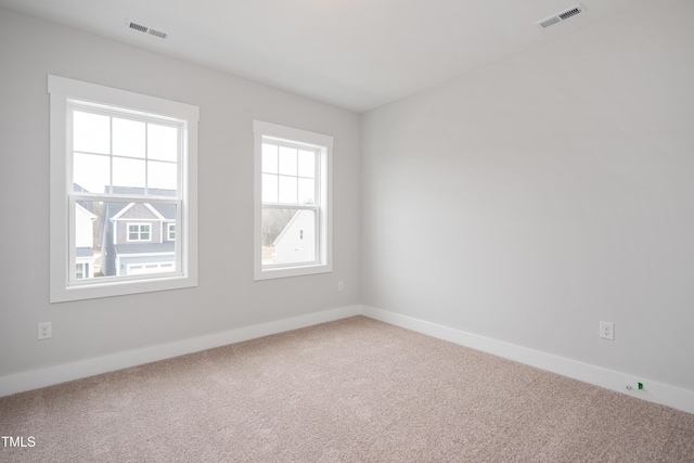 spare room with carpet floors