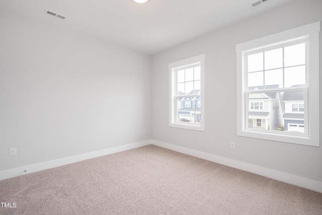 spare room featuring carpet flooring