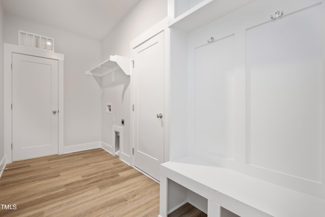 mudroom with light hardwood / wood-style floors