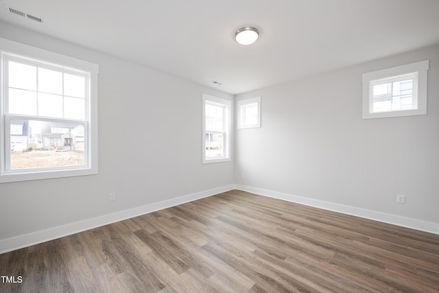 spare room featuring hardwood / wood-style floors