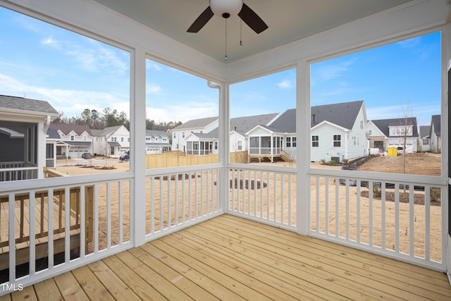 sunroom / solarium with ceiling fan