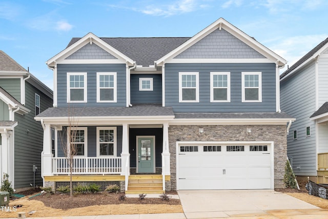 craftsman house with a garage and a porch