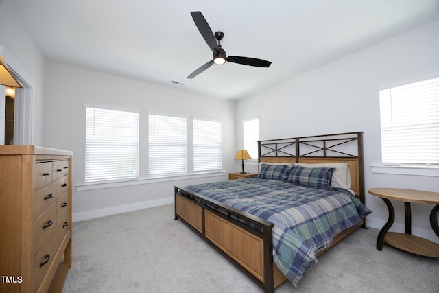 bedroom featuring ceiling fan and light colored carpet