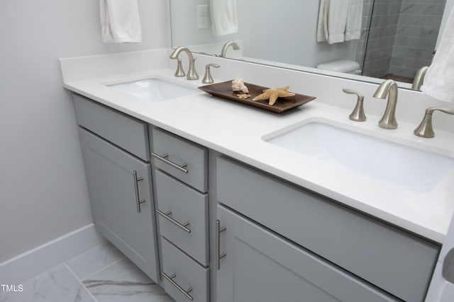 bathroom featuring walk in shower, vanity, and toilet