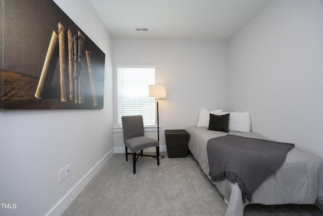 bedroom with light colored carpet