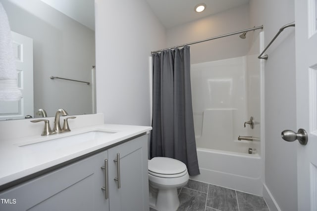 full bathroom featuring vanity, shower / bath combo with shower curtain, and toilet