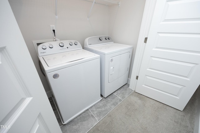 washroom with light colored carpet and independent washer and dryer