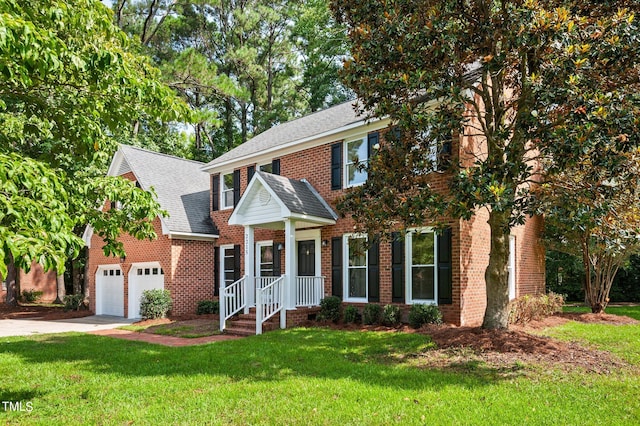 view of front facade with a garage and a front lawn