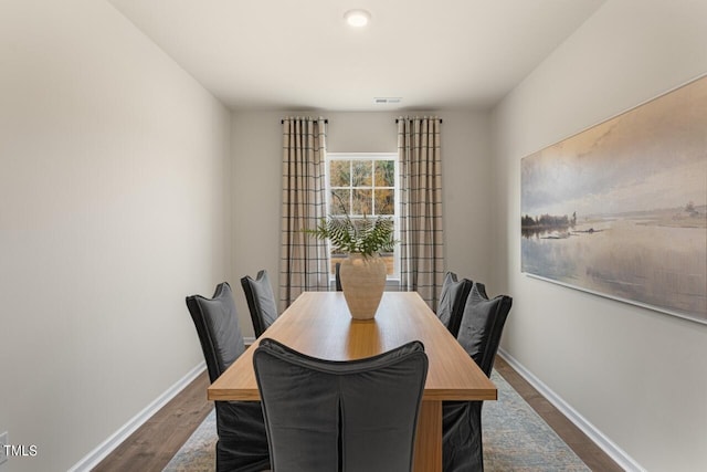 dining area with dark wood-type flooring