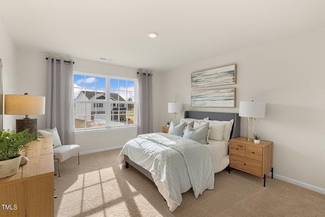 bedroom with light carpet