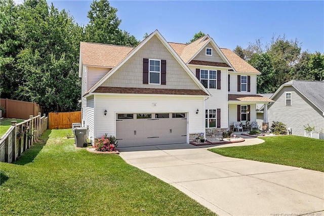 craftsman-style home with a garage and a front lawn