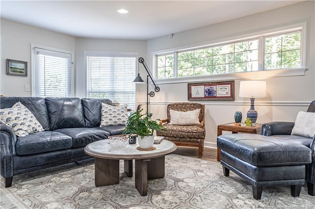 living room with light wood-style floors and recessed lighting