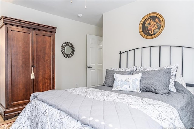 bedroom featuring wood finished floors