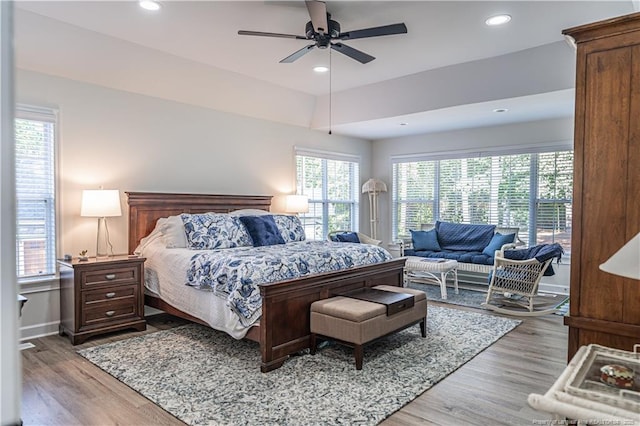 bedroom with baseboards, recessed lighting, a ceiling fan, and light wood-style floors