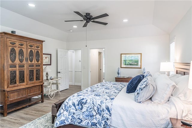 bedroom featuring a ceiling fan, vaulted ceiling, wood finished floors, and recessed lighting