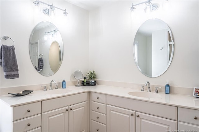 full bath with double vanity and a sink