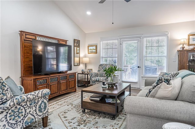 living area featuring light wood-style floors, vaulted ceiling, a ceiling fan, and recessed lighting