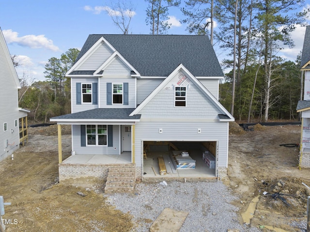 view of front of home with a garage and covered porch