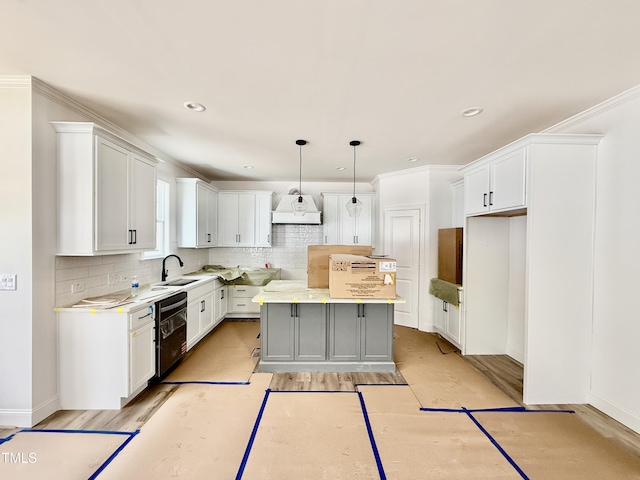 kitchen with a center island, black dishwasher, custom exhaust hood, decorative backsplash, and a sink