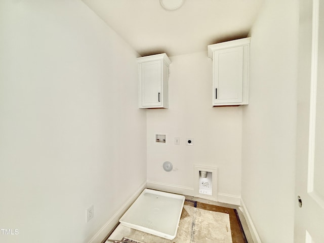 laundry area featuring hookup for a gas dryer, washer hookup, baseboards, cabinet space, and electric dryer hookup