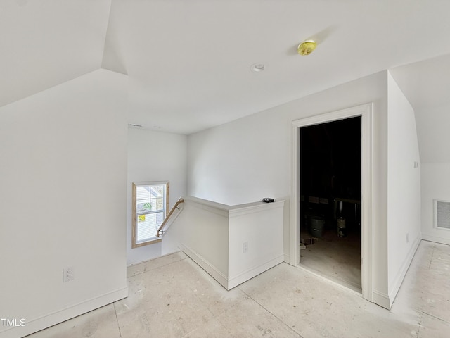 unfurnished room featuring visible vents and baseboards