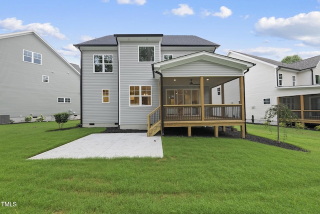 2621 Silver Gate Ct, Wake Forest, NC 27587 - back of property with a sunroom, a patio area, a lawn, and a ceiling fan