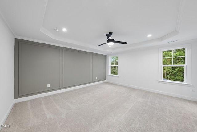 2621 Silver Gate Ct, Wake Forest, NC 27587 - unfurnished bedroom with a tray ceiling, recessed lighting, light colored carpet, ornamental molding, and a ceiling fan