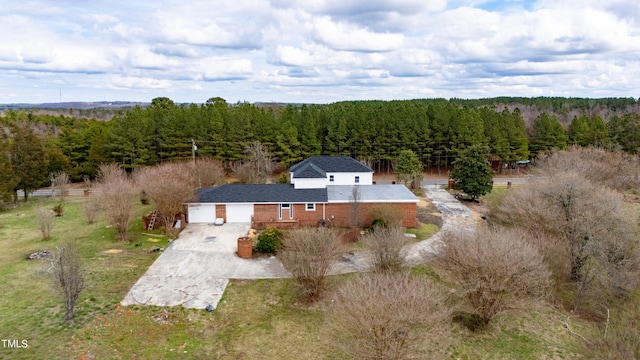 drone / aerial view with a view of trees