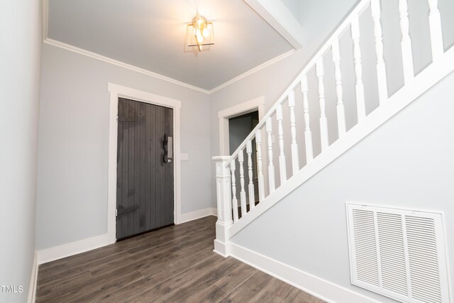 foyer featuring visible vents, stairway, crown molding, baseboards, and dark wood-style flooring