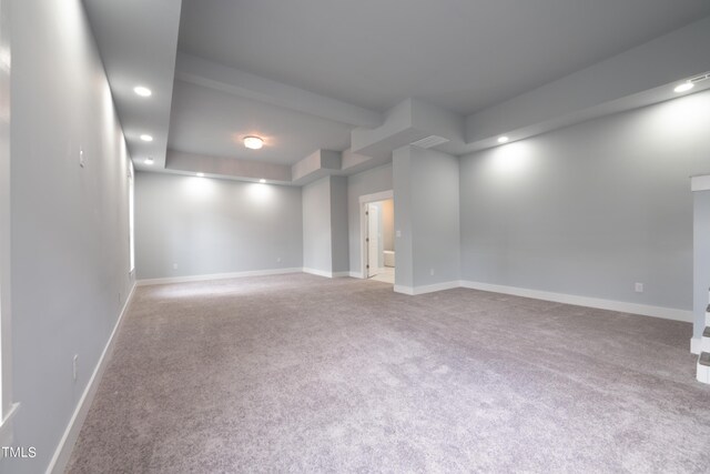 carpeted spare room featuring recessed lighting and baseboards