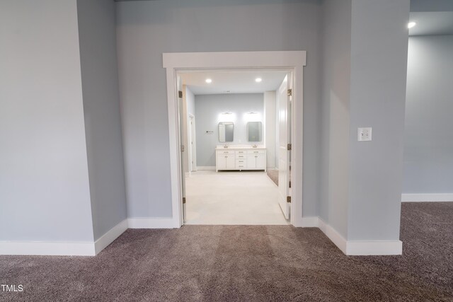 corridor featuring recessed lighting, baseboards, and carpet flooring