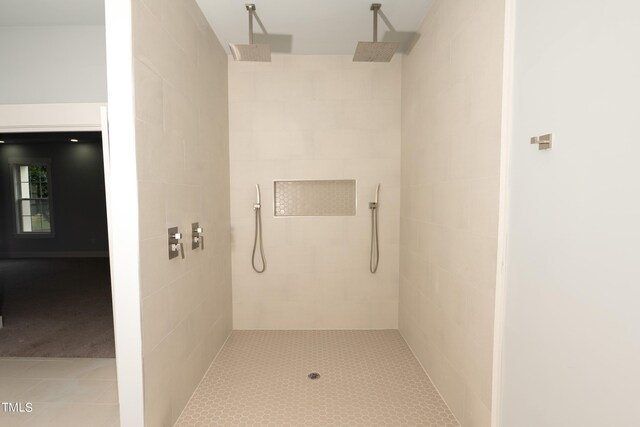 bathroom with a tile shower