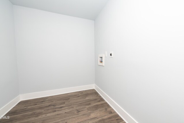 washroom with electric dryer hookup, dark wood-style floors, baseboards, hookup for a washing machine, and laundry area