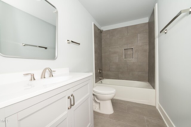 bathroom with vanity, tile patterned floors, toilet, and shower / washtub combination