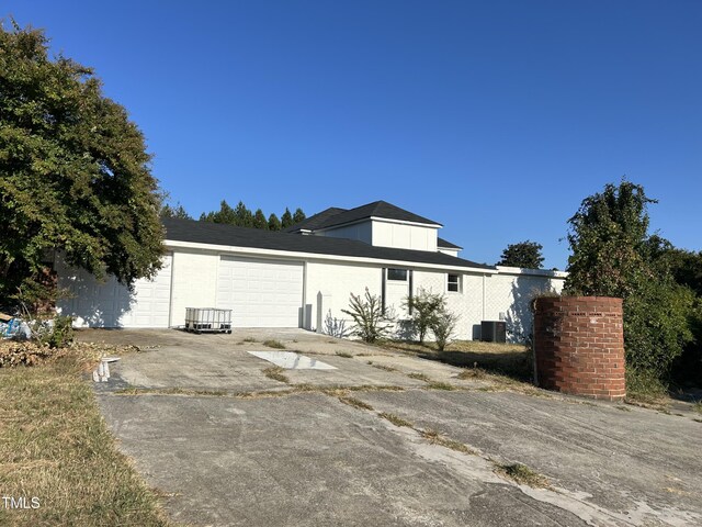 view of front of property with central air condition unit