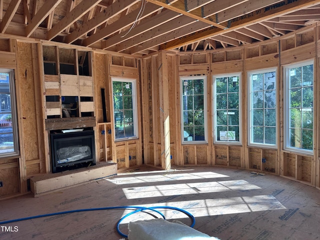 misc room featuring a fireplace and plenty of natural light