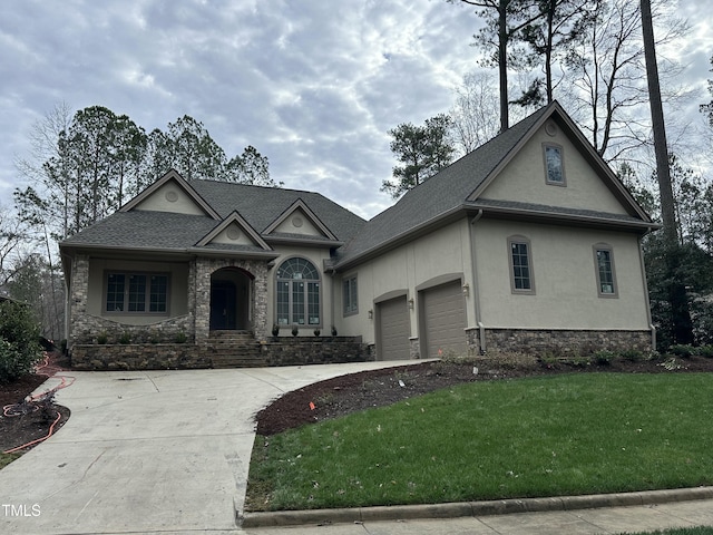 view of front of property featuring a garage and a front lawn