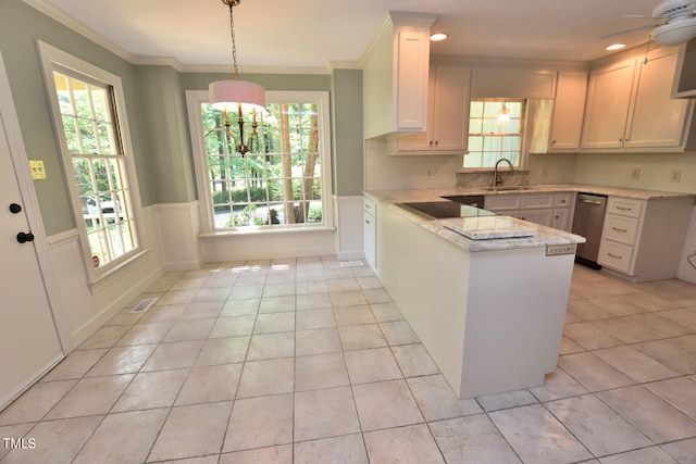 kitchen with pendant lighting, ceiling fan with notable chandelier, kitchen peninsula, stainless steel dishwasher, and white cabinets