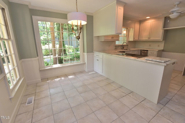 kitchen featuring white cabinets, kitchen peninsula, decorative light fixtures, and ceiling fan