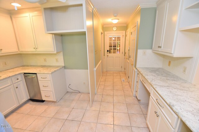 kitchen featuring ornamental molding, white cabinetry, light tile patterned floors, and light stone countertops