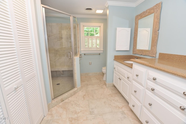 bathroom with crown molding, vanity, toilet, and a shower with shower door