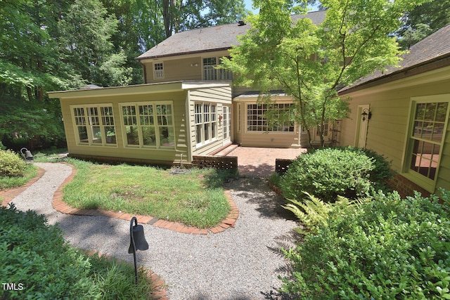 back of property with a patio area